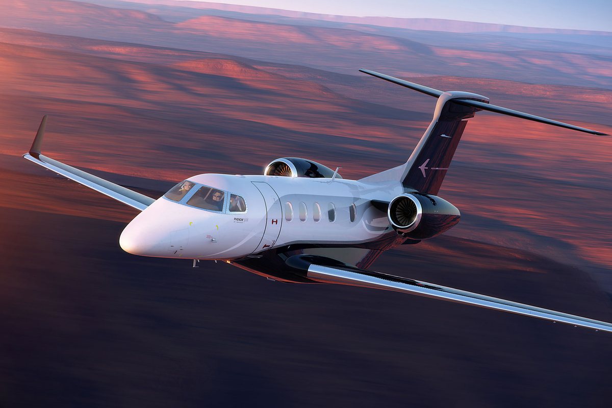 Embraer Phenom 300E light jet in flight