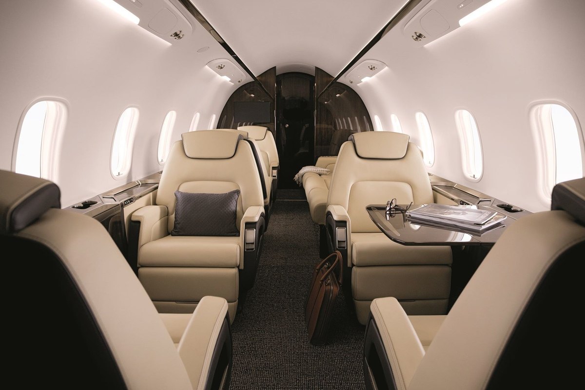 Super midsize jet cabin with cream leather seats