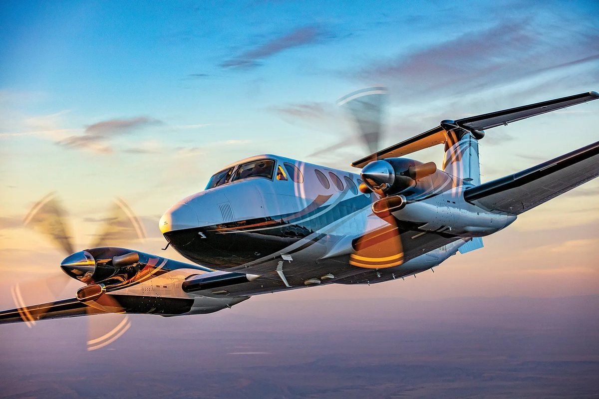King Air turboprop in flight at sunset